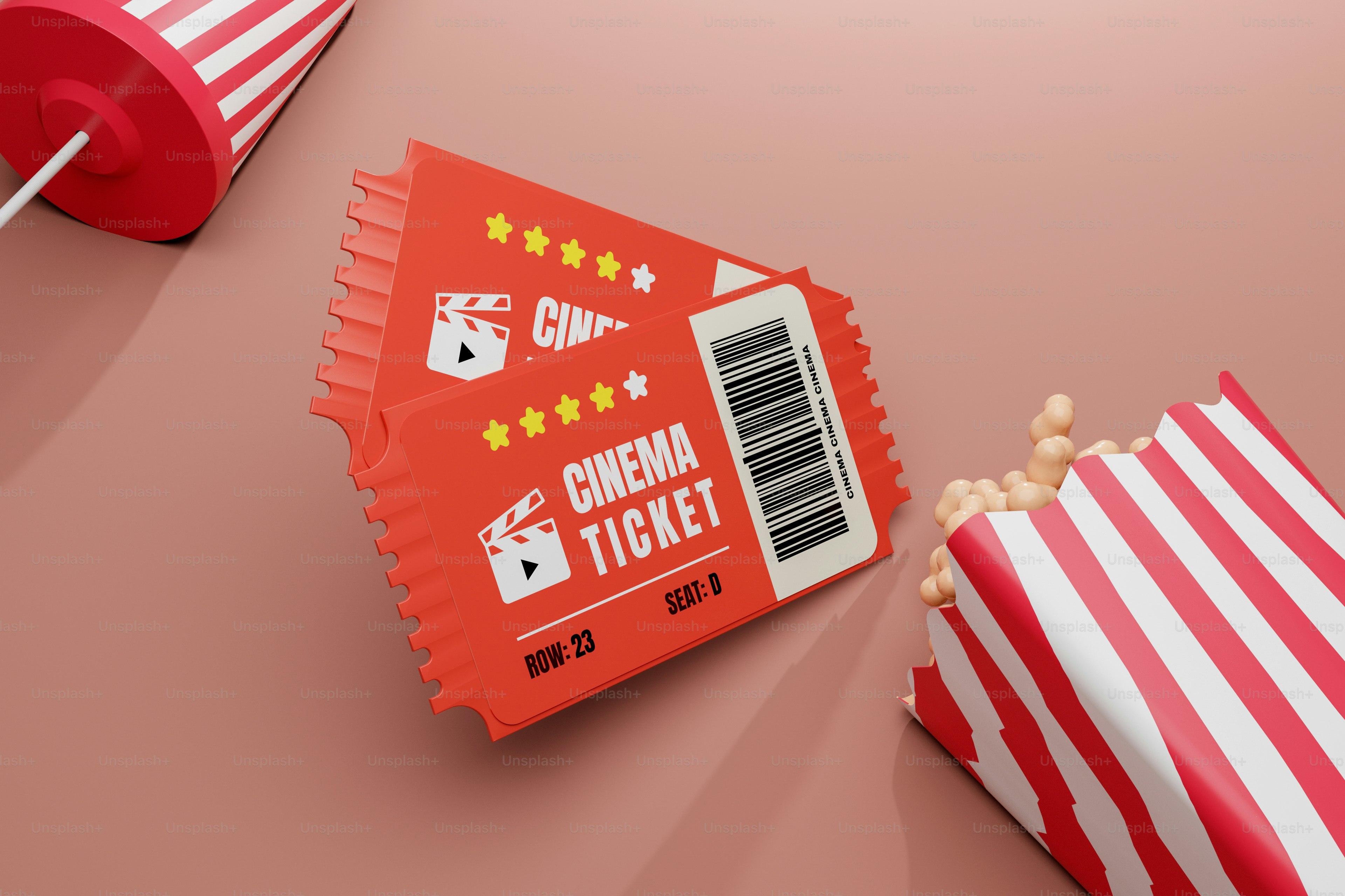 a red and white striped bag of popcorn next to a red and white striped bag